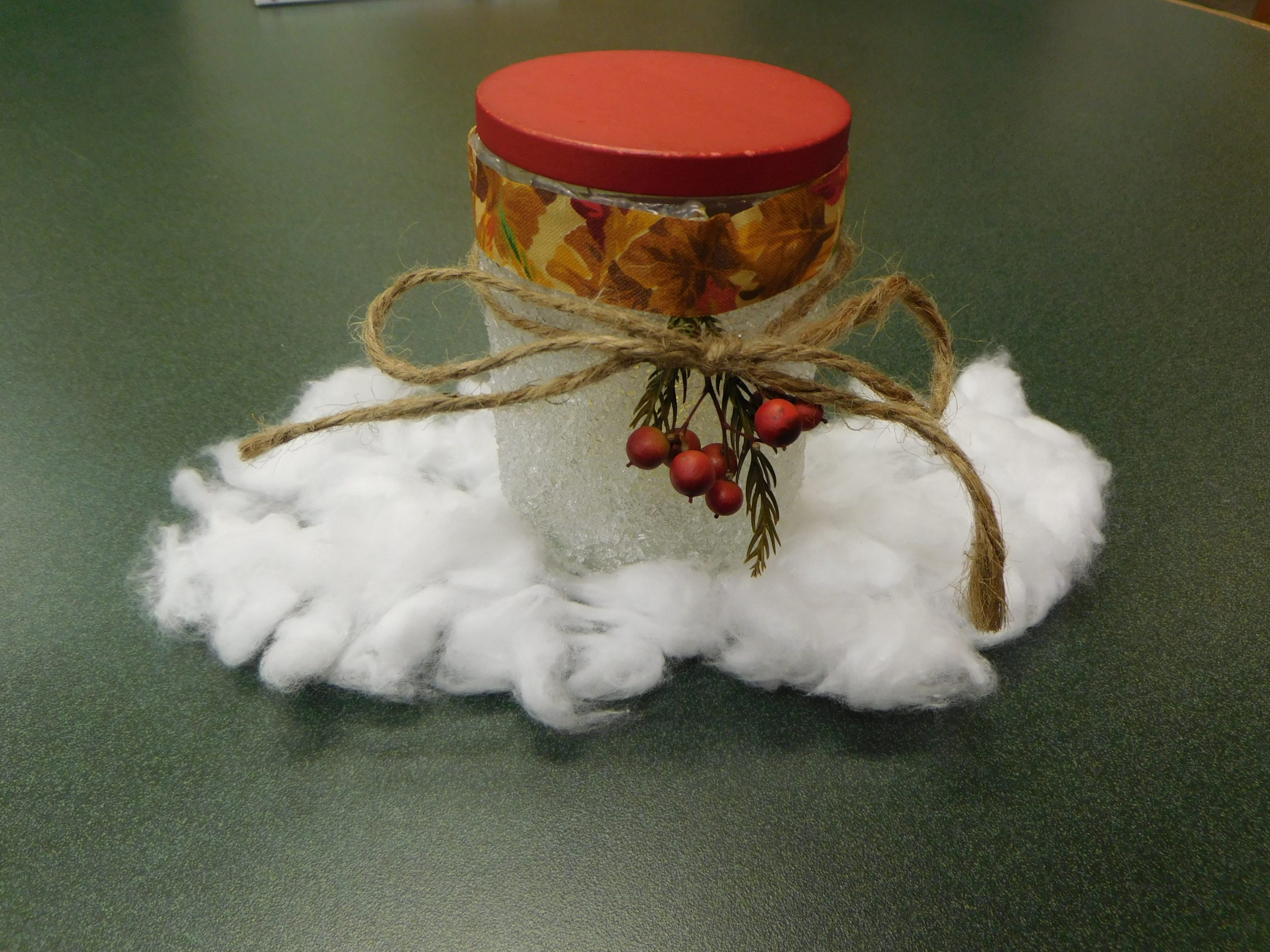 Decorative crafted holiday jar with candle inside