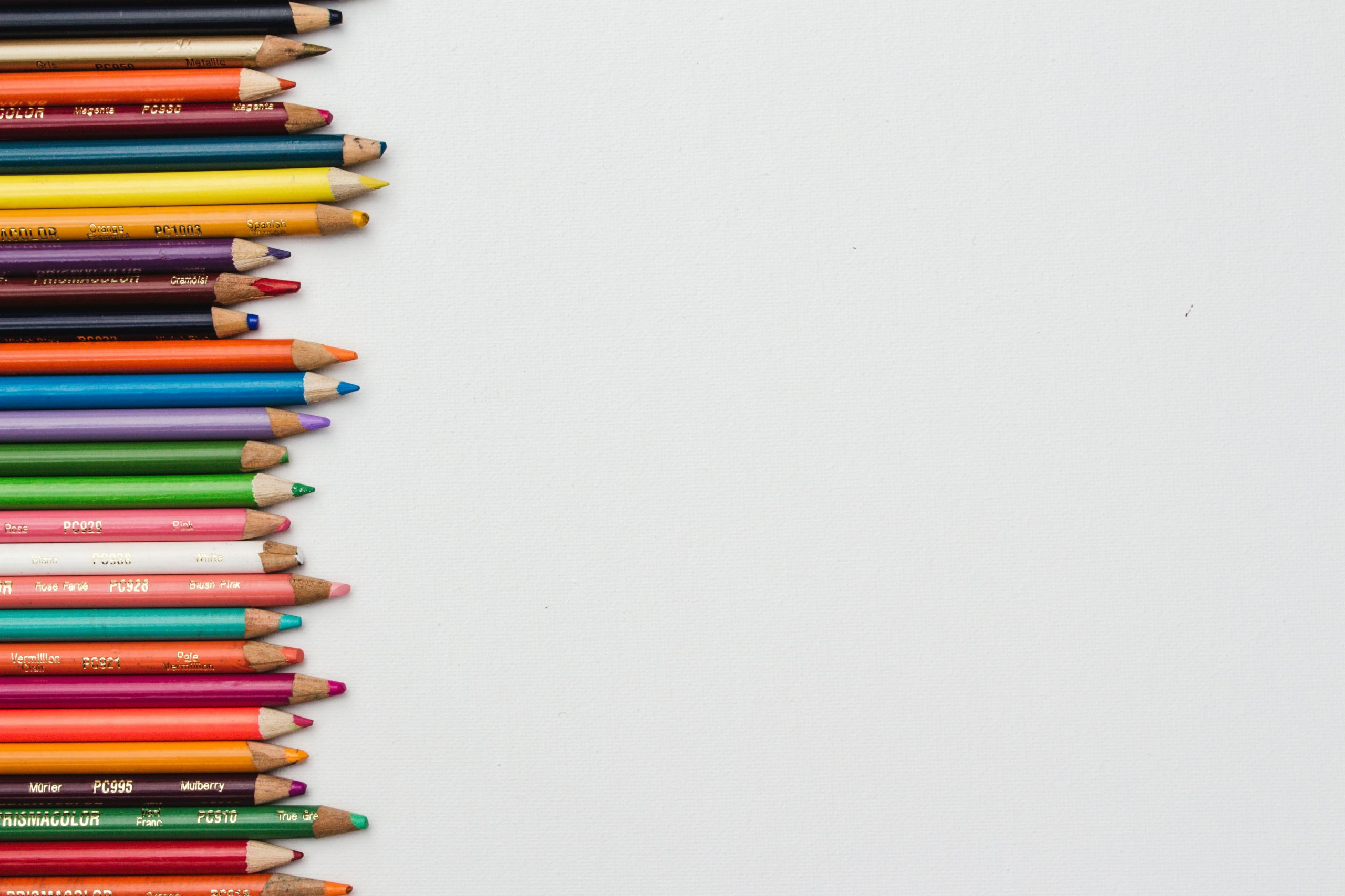 Colored pencils stacked on left side of image